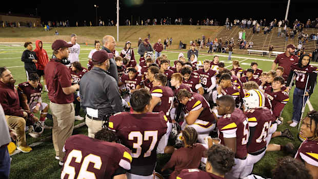 Higbee talks to team
